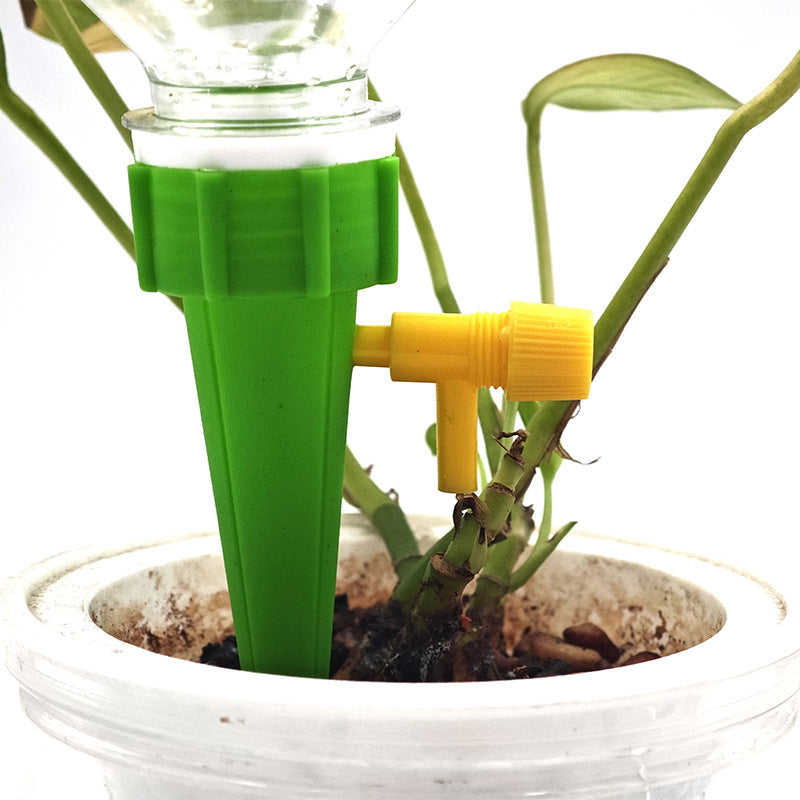 Tool-free installation demonstration inserting spike into potted plant soil